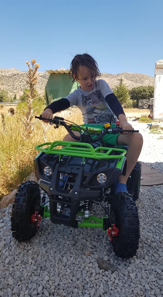Tyler showing off his skills on a quad bike
